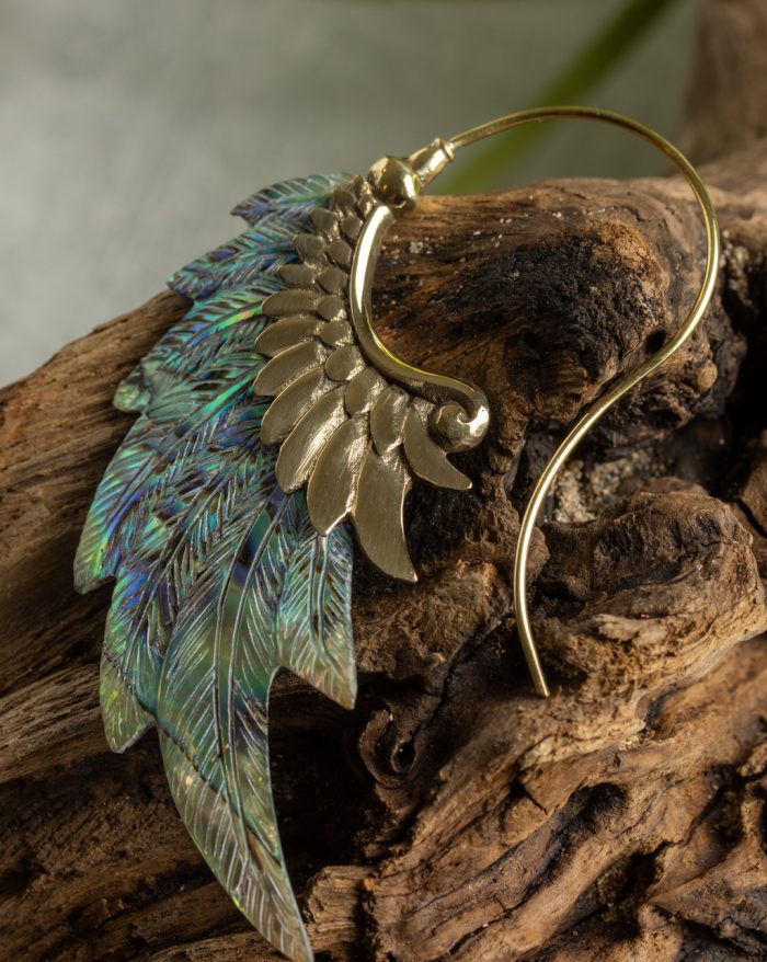 Hand-carved gold-plated feather earrings from the Bali collection with abalone shell accents, handmade with native craftsmanship.