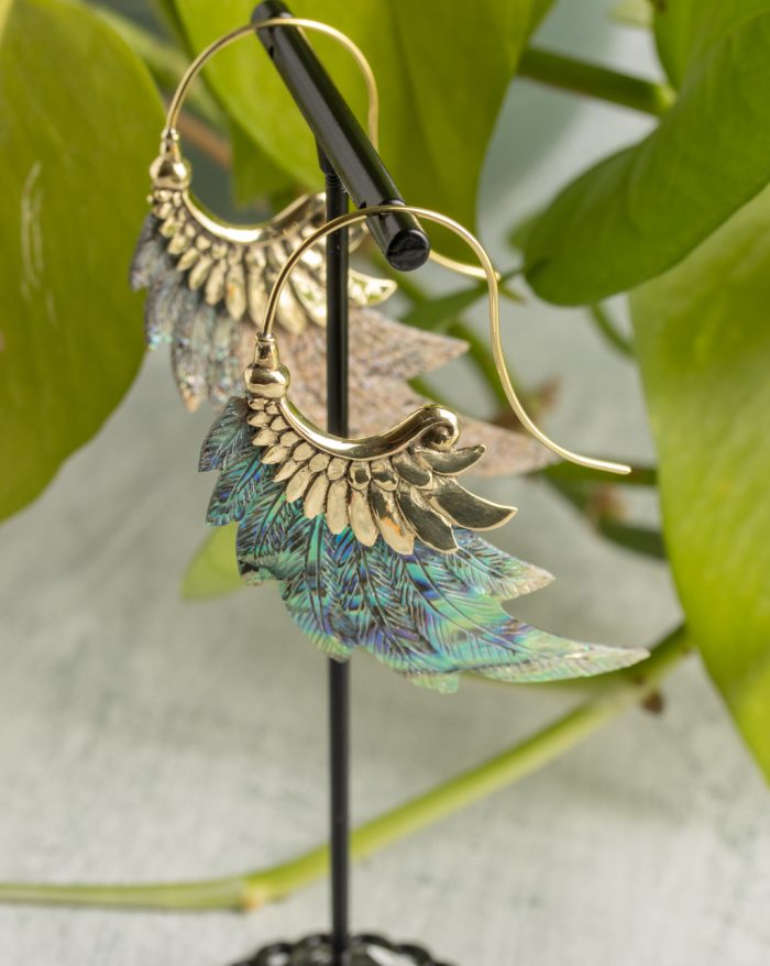 Hand-carved gold-plated feather earrings from the Bali collection with abalone shell accents, handmade with native craftsmanship.