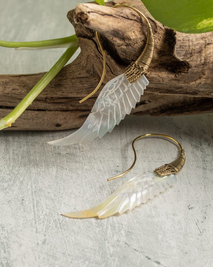 Hand-carved gold-plated feather earrings from the Bali collection, featuring mother-of-pearl accents, a statement piece.