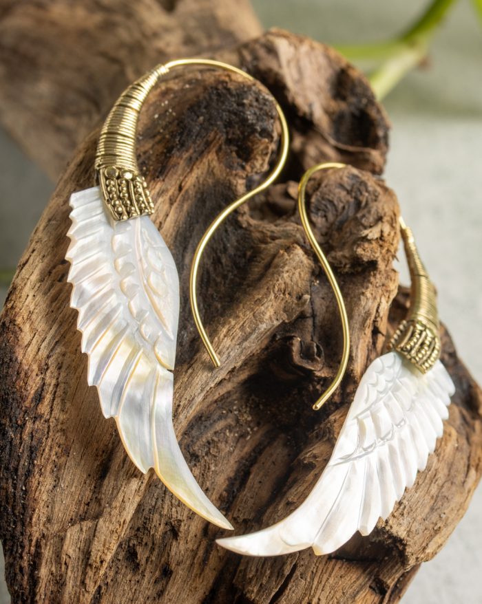 Hand-carved gold-plated feather earrings from the Bali collection, featuring mother-of-pearl accents, a statement piece.