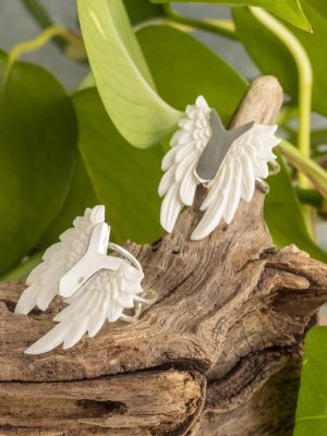 Hand-carved silver feather ring from the Bali collection, available in abalone and bone versions, showcasing native craftsmanship. Adjustable