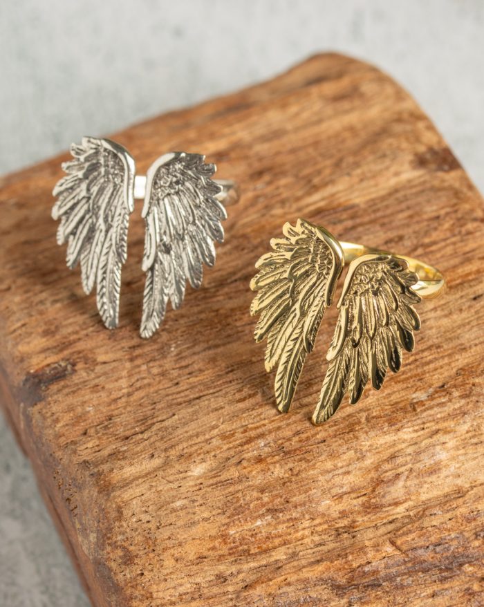 Adjustable silver and gold-plated feather ring, hand-carved with a symbolic feather design.