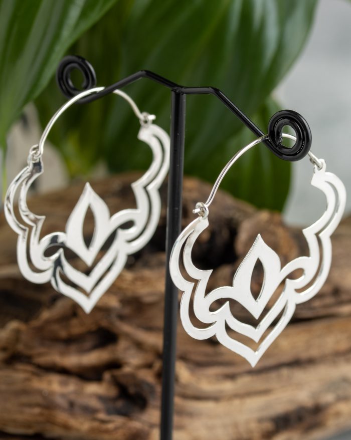 Handmade silver Bali lotus earrings with delicate symmetry, inspired by the beauty of the lotus flower and crafted by artisans.