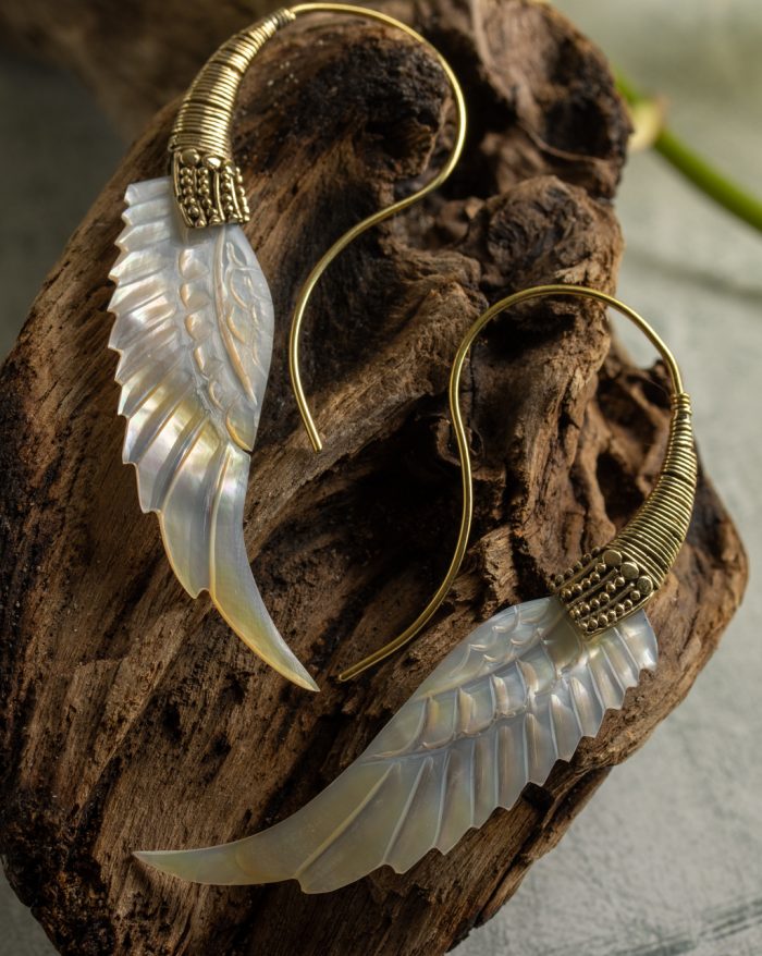 Hand-carved gold-plated feather earrings from the Bali collection, featuring mother-of-pearl accents, a statement piece.