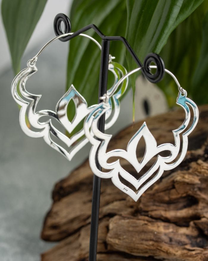 Handmade silver Bali lotus earrings with delicate symmetry, inspired by the beauty of the lotus flower and crafted by artisans.