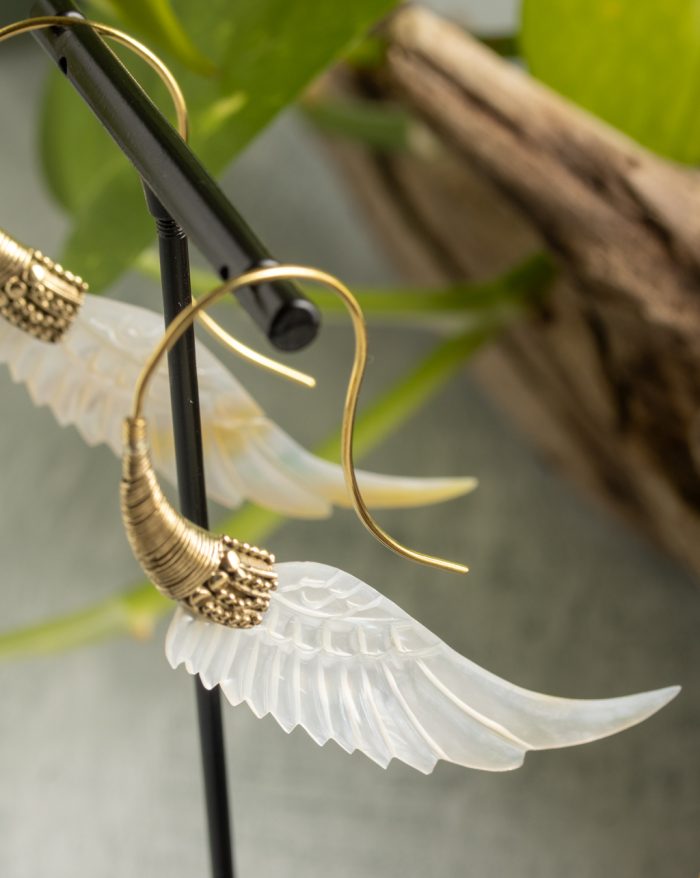 Hand-carved gold-plated feather earrings from the Bali collection, featuring mother-of-pearl accents, a statement piece.