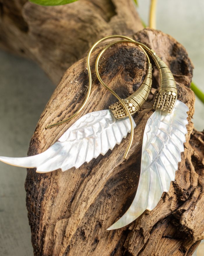 Hand-carved gold-plated feather earrings from the Bali collection, featuring mother-of-pearl accents, a statement piece.