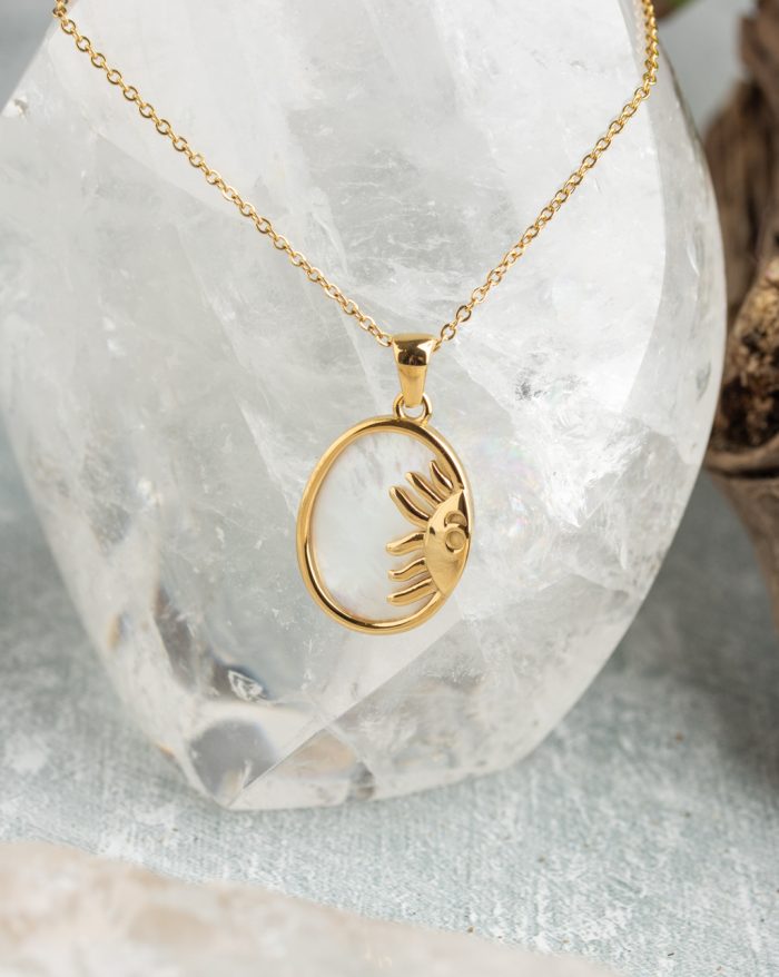 Gold-plated esoteric pendant with symbolic designs, paired with a matching chain, representing deep meaning and spirituality.