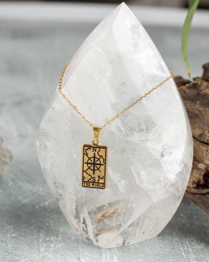 Gold-plated esoteric pendant with symbolic designs, paired with a matching chain, representing deep meaning and spirituality.