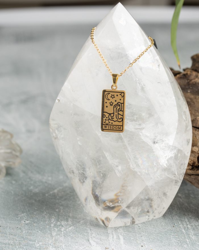 Gold-plated esoteric pendant with symbolic designs, paired with a matching chain, representing deep meaning and spirituality.