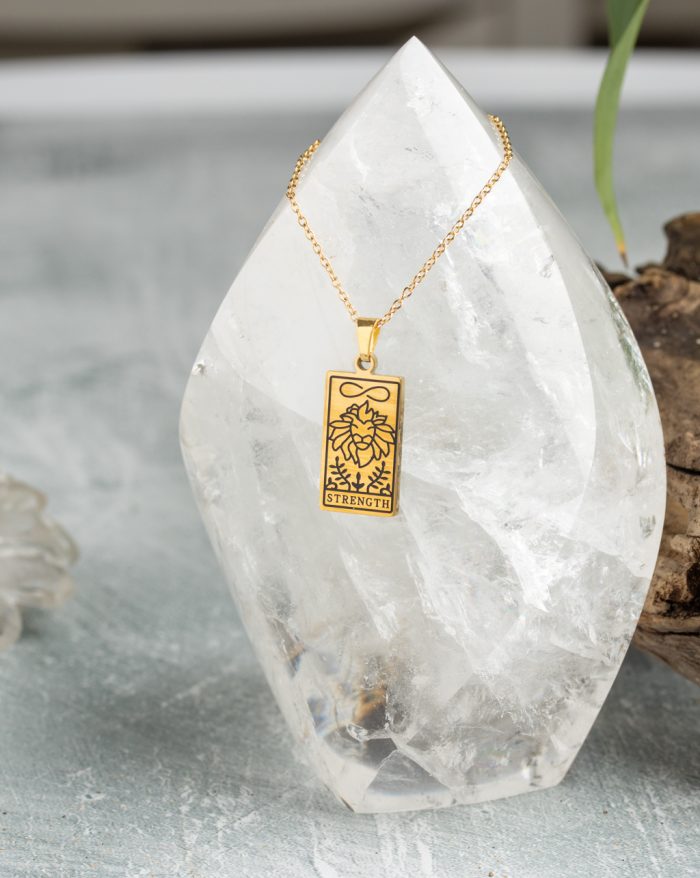 Gold-plated esoteric pendant with symbolic designs, paired with a matching chain, representing deep meaning and spirituality.