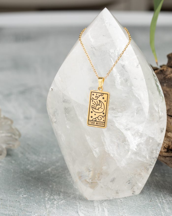 Gold-plated esoteric pendant with symbolic designs, paired with a matching chain, representing deep meaning and spirituality.