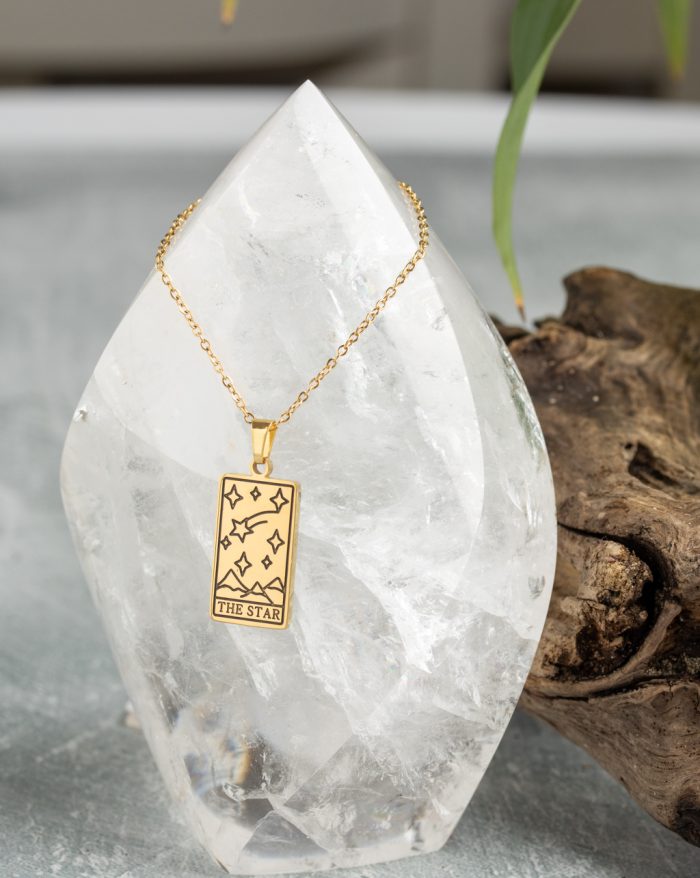 Gold-plated esoteric pendant with symbolic designs, paired with a matching chain, representing deep meaning and spirituality.