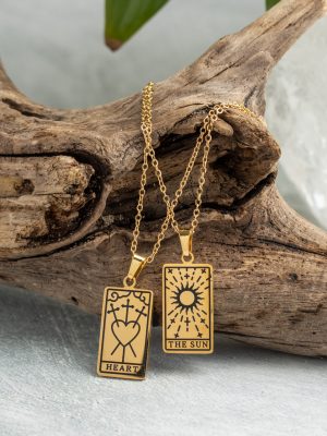 Gold-plated esoteric pendant with symbolic designs, paired with a matching chain, representing deep meaning and spirituality.