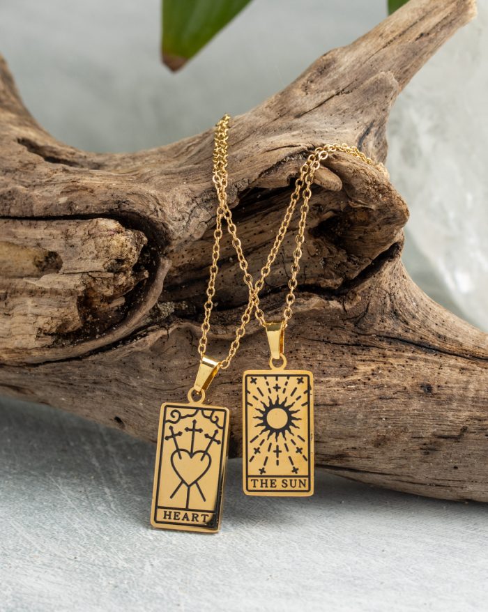 Gold-plated esoteric pendant with symbolic designs, paired with a matching chain, representing deep meaning and spirituality.