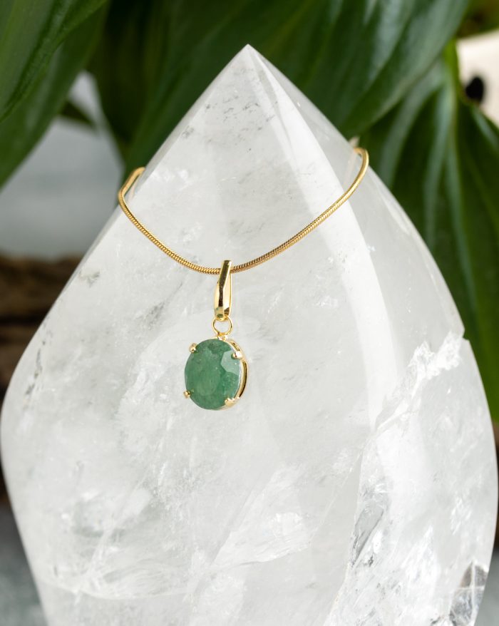 Handmade gold-plated pendant with round gemstones, symbolizing beauty and healing power, crafted with artisan care.