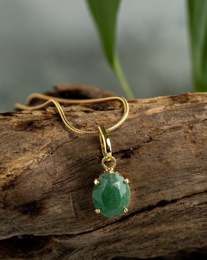 Handmade gold-plated pendant with round gemstones, symbolizing beauty and healing power, crafted with artisan care.