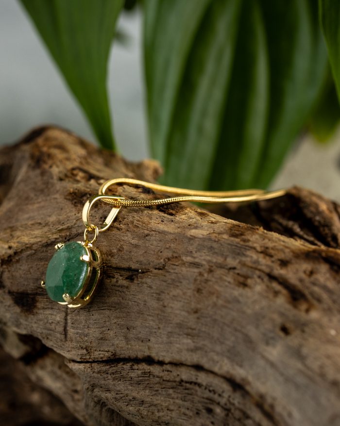 Handmade gold-plated pendant with round gemstones, symbolizing beauty and healing power, crafted with artisan care.