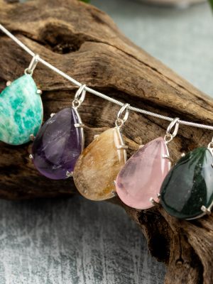 Handmade silver pendant with large teardrop-shaped gemstones, available in rose quartz, citrine, amethyst, obsidian, and aventurine variations.