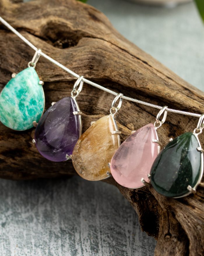 Handmade silver pendant with large teardrop-shaped gemstones, available in rose quartz, citrine, amethyst, obsidian, and aventurine variations.