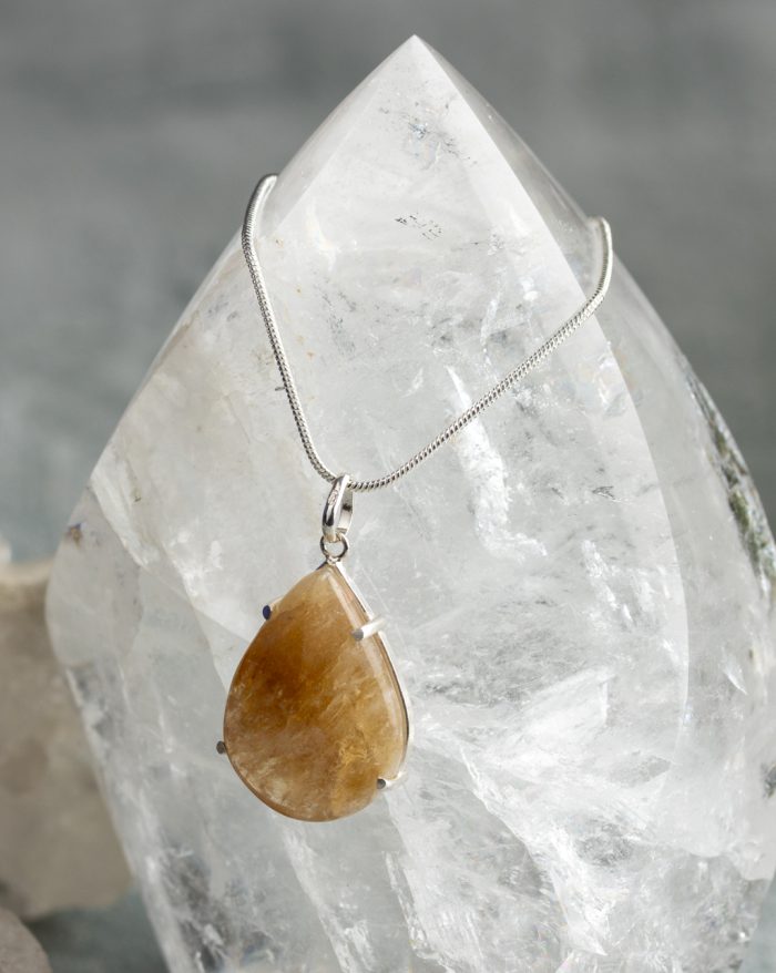 Handmade silver pendant with large teardrop-shaped gemstones, available in rose quartz, citrine, amethyst, obsidian, and aventurine variations.