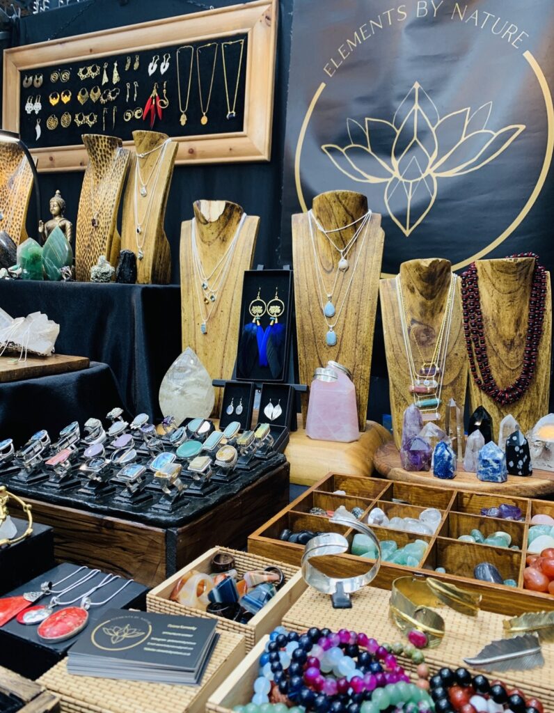 Silver rings, wooden necklace busts and crystals on the Elements by Nature stall at Old Spitalfields Market